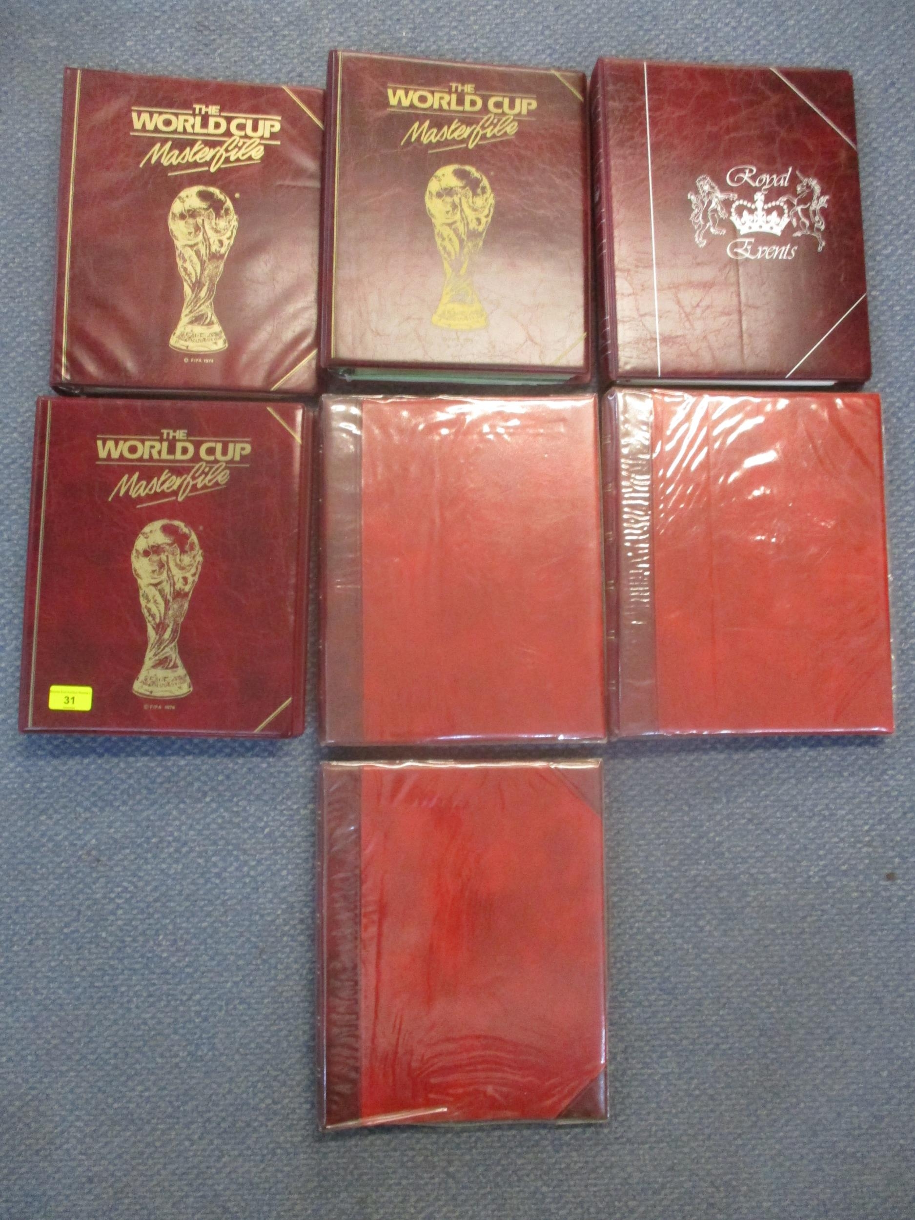 Seven albums of commemorative and world stamps to include three albums of The World Cup Masterfile