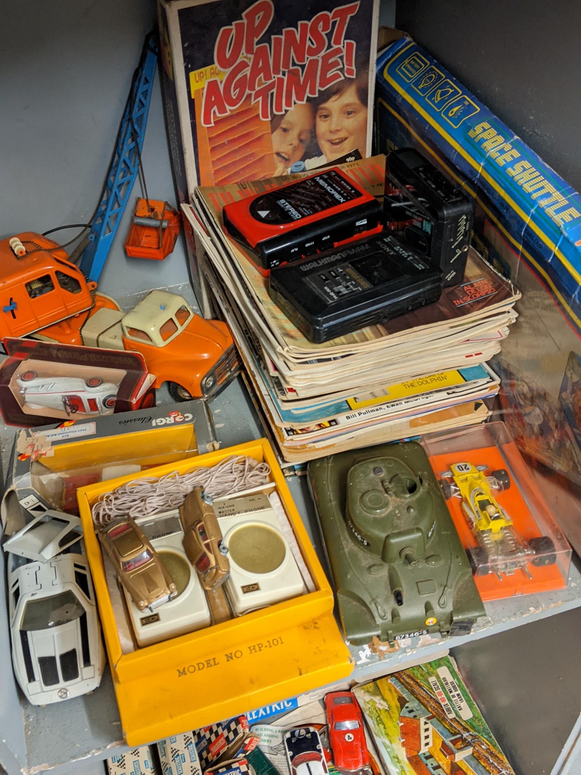 Vintage games to include Up Against Time, model cars, annuals, magazines, a Walkman and others along - Image 2 of 3