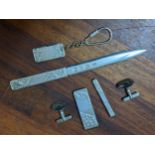A silver gentleman's set of cufflinks, money clip, tie clip, paper knife and keyring with engraved