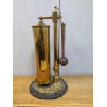 A WWI shell case dinner gong on a turned brass stand and wooden base, 44cm high Location: