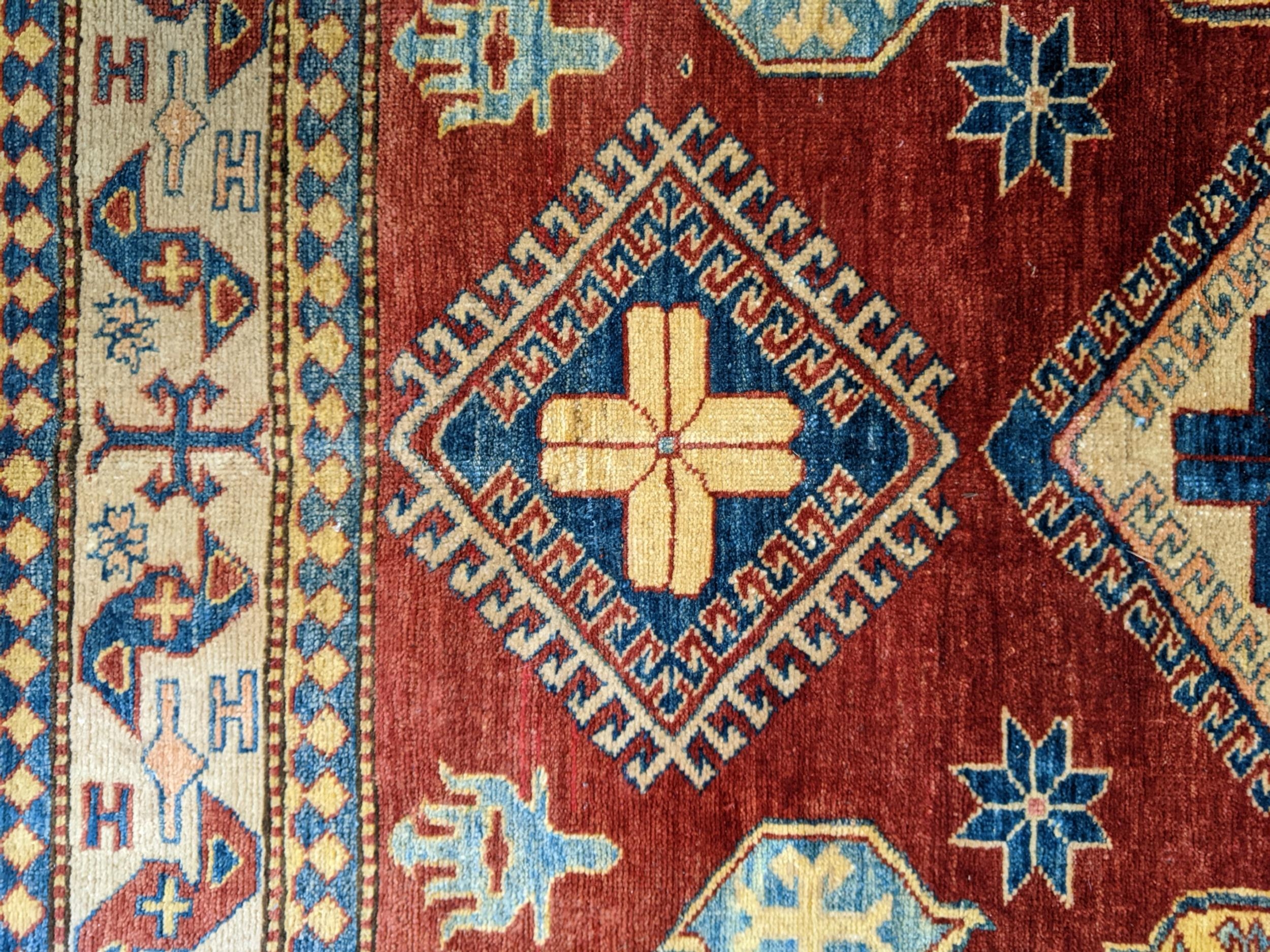 A Caucasian design Turkish rug with geometric motifs on a beige ground 160cm x 134cm - Image 3 of 3