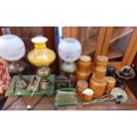 A vintage lot to include three brass oil lamps, one converted to electricity, a desk set, Hornsea