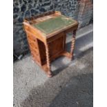 A Victorian rosewood Davenport with a fitted interior, barleytwist columns and four drawers