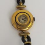 An early 20th century ladies 18ct gold cased manual wind wristwatch having a small round, worn