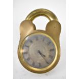 An early 20th century unusual bedside/travel clock in the form of a padlock in a brass case, the