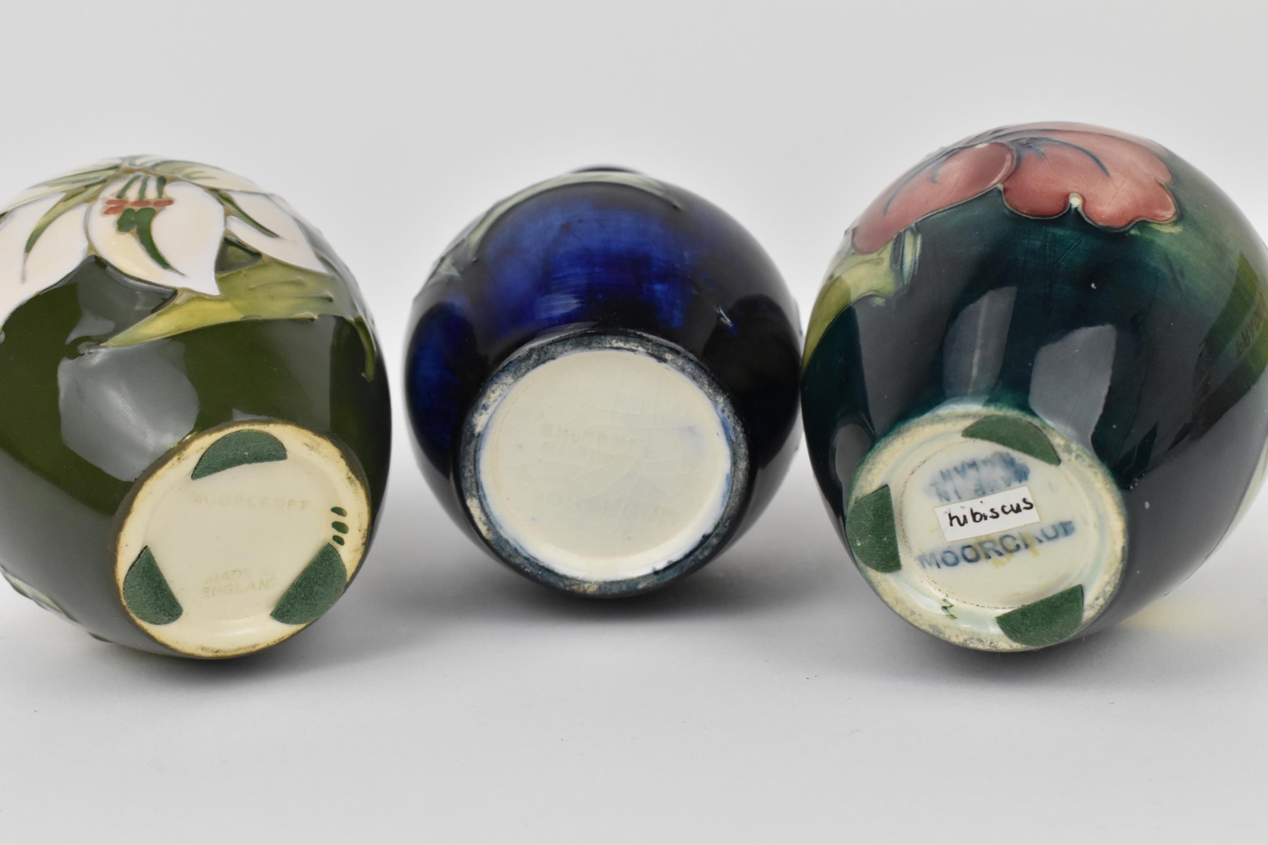 A small collection of Moorcroft ceramic vases, to include 'hibiscus', 'Bermuda Lily' and ' - Image 2 of 4