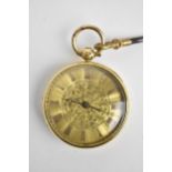 A Victorian 18ct gold open faced pocket watch having a floral engraved gilt dial with Roman numerals