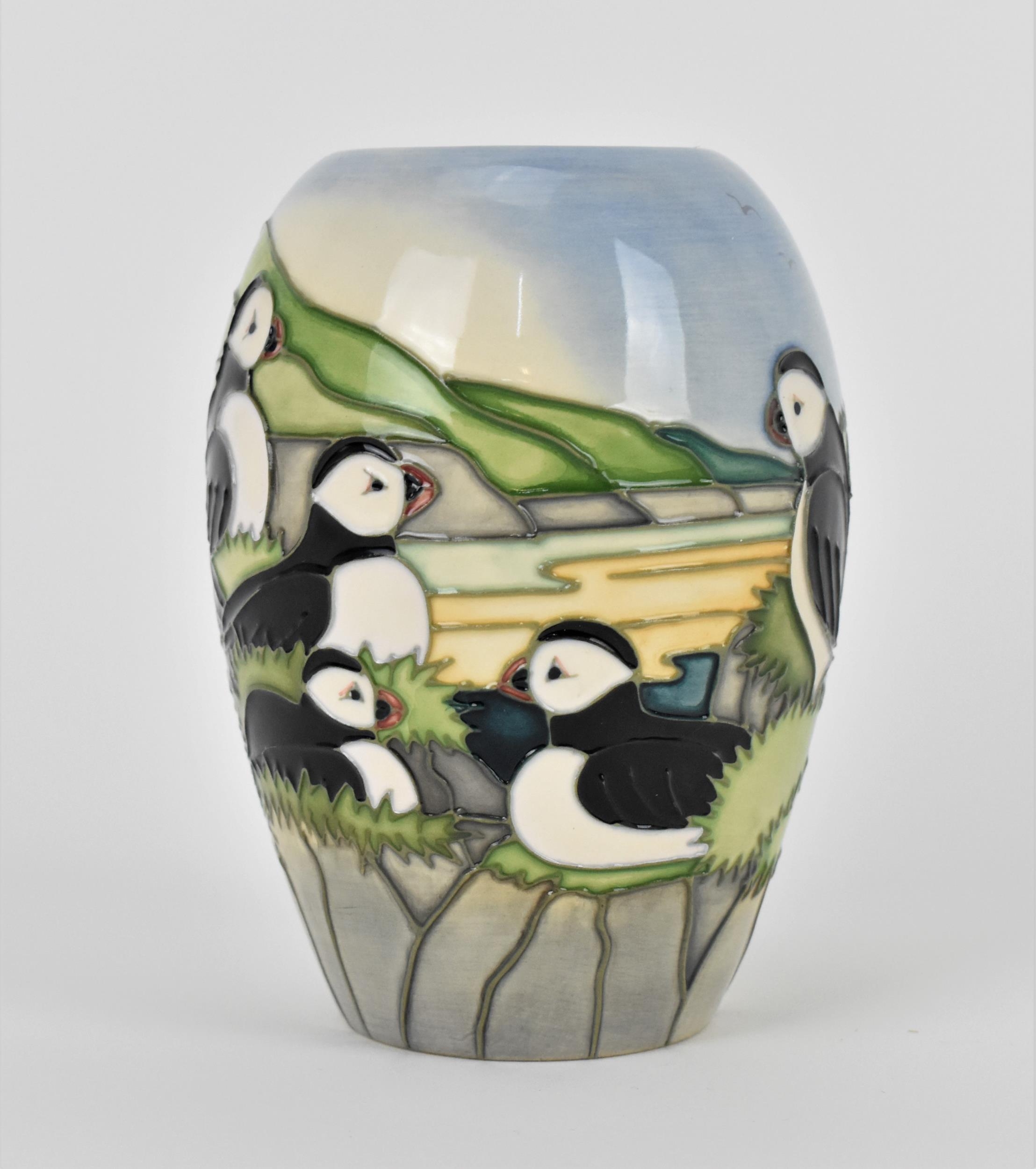 A Moorcroft ceramic baluster vase in the 'Puffin' pattern designed by Carol Lovett, 1997, with