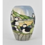 A Moorcroft ceramic baluster vase in the 'Puffin' pattern designed by Carol Lovett, 1997, with