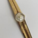 A vintage ladies 9ct gold cased manual wind Rotary wristwatch having a silvered dial with applied