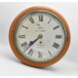 An early 20th century ash framed Dent 10 inch dial clock, the white enamel dial having Roman