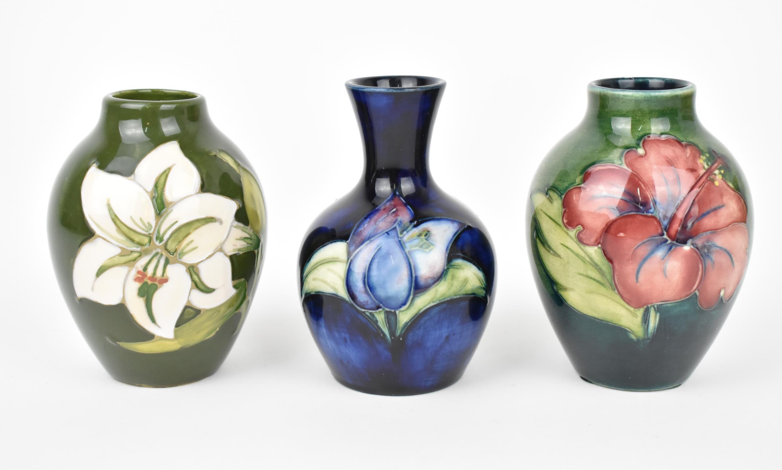 A small collection of Moorcroft ceramic vases, to include 'hibiscus', 'Bermuda Lily' and '