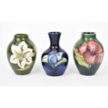 A small collection of Moorcroft ceramic vases, to include 'hibiscus', 'Bermuda Lily' and '