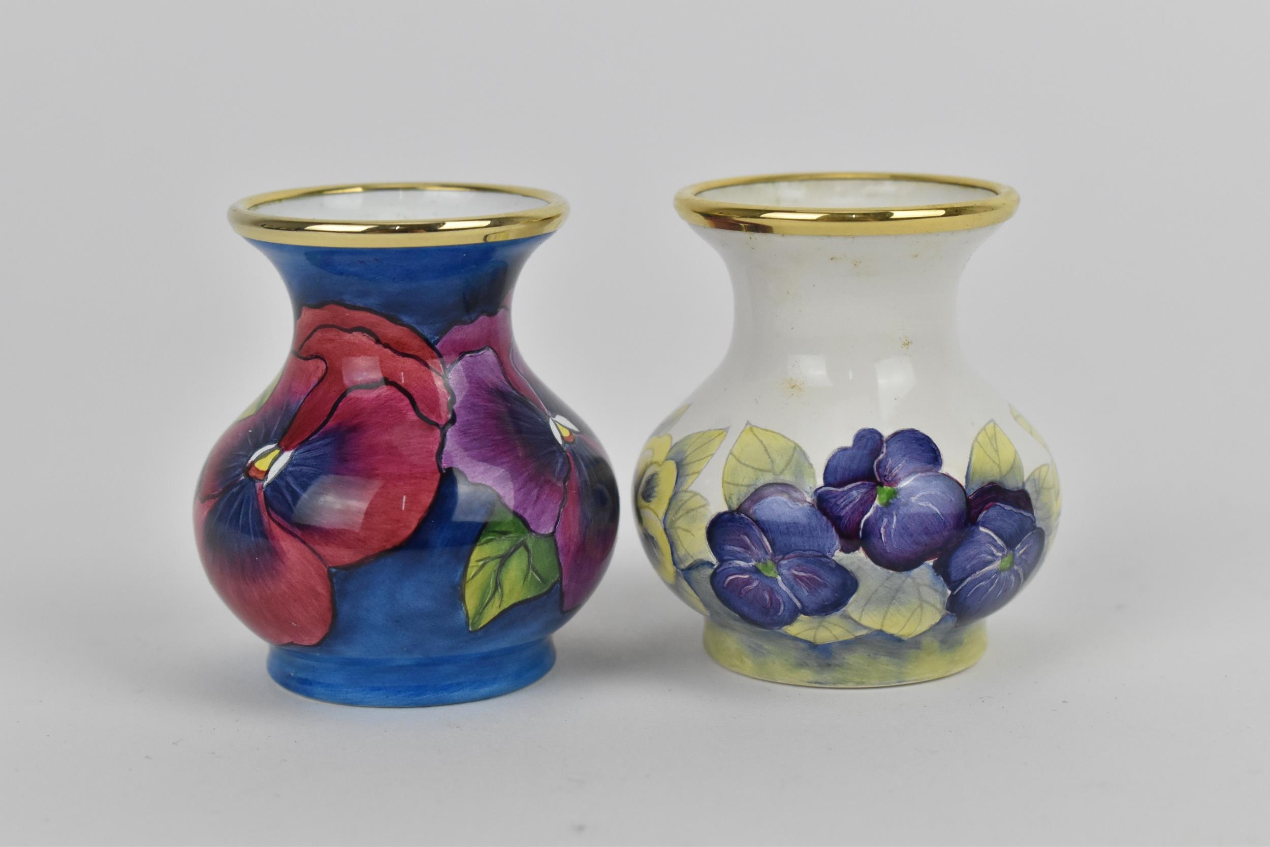 Two Moorcroft Enamels Ltd miniature vases, both of baluster form with painted pansies, the blue - Image 4 of 4