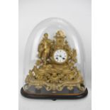 A late 19th century French gilt metal mantle clock, the case decorated with a figure, pierced floral