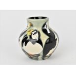 A small Moorcroft pottery vase in the 'Puffins' pattern by Kerry Goodwin, 2007, with various
