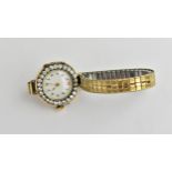 A ladies early 20th century manual wind 18ct gold cased wristwatch having a white porcelain dial