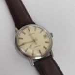 A gents stainless steel Longines Conquest Automatic wristwatch having a silvered dial with baton