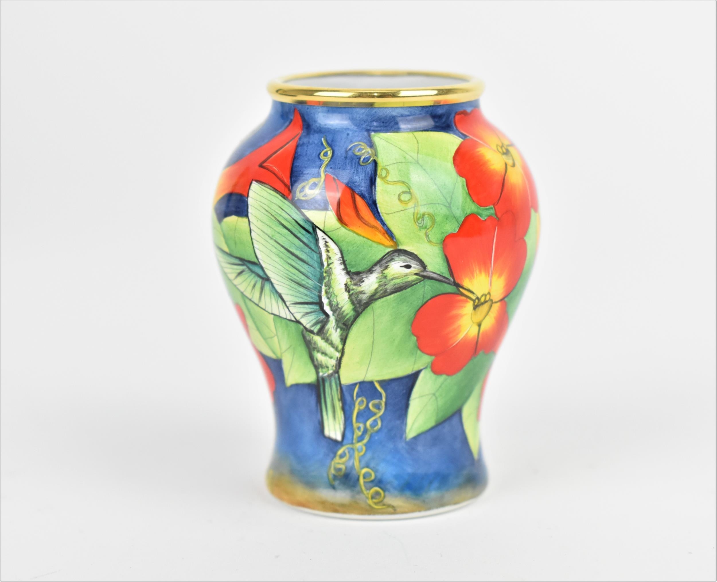 A Moorcroft Enamels Ltd miniature baluster vase, painted by Faye Williams with hummingbirds drinking