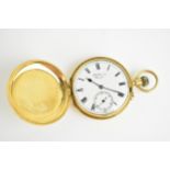 An early 20th century 18ct gold, manual wind Hunter pocket watch, having a white enamel dial