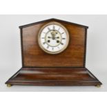 A 19th century 8 day mantle clock, the mahogany case having beaded moulding, stepped base and raised