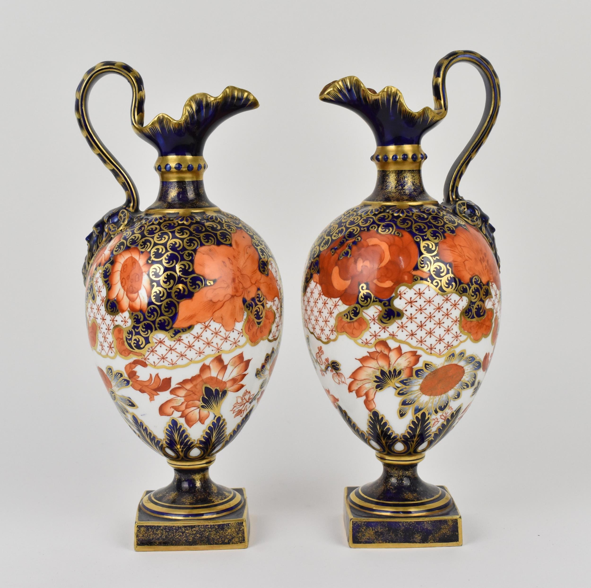 A pair of Royal Crown Derby ewers in the imari pattern, shape no. 350, with ovoid bodies, frill rim,