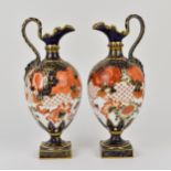 A pair of Royal Crown Derby ewers in the imari pattern, shape no. 350, with ovoid bodies, frill rim,