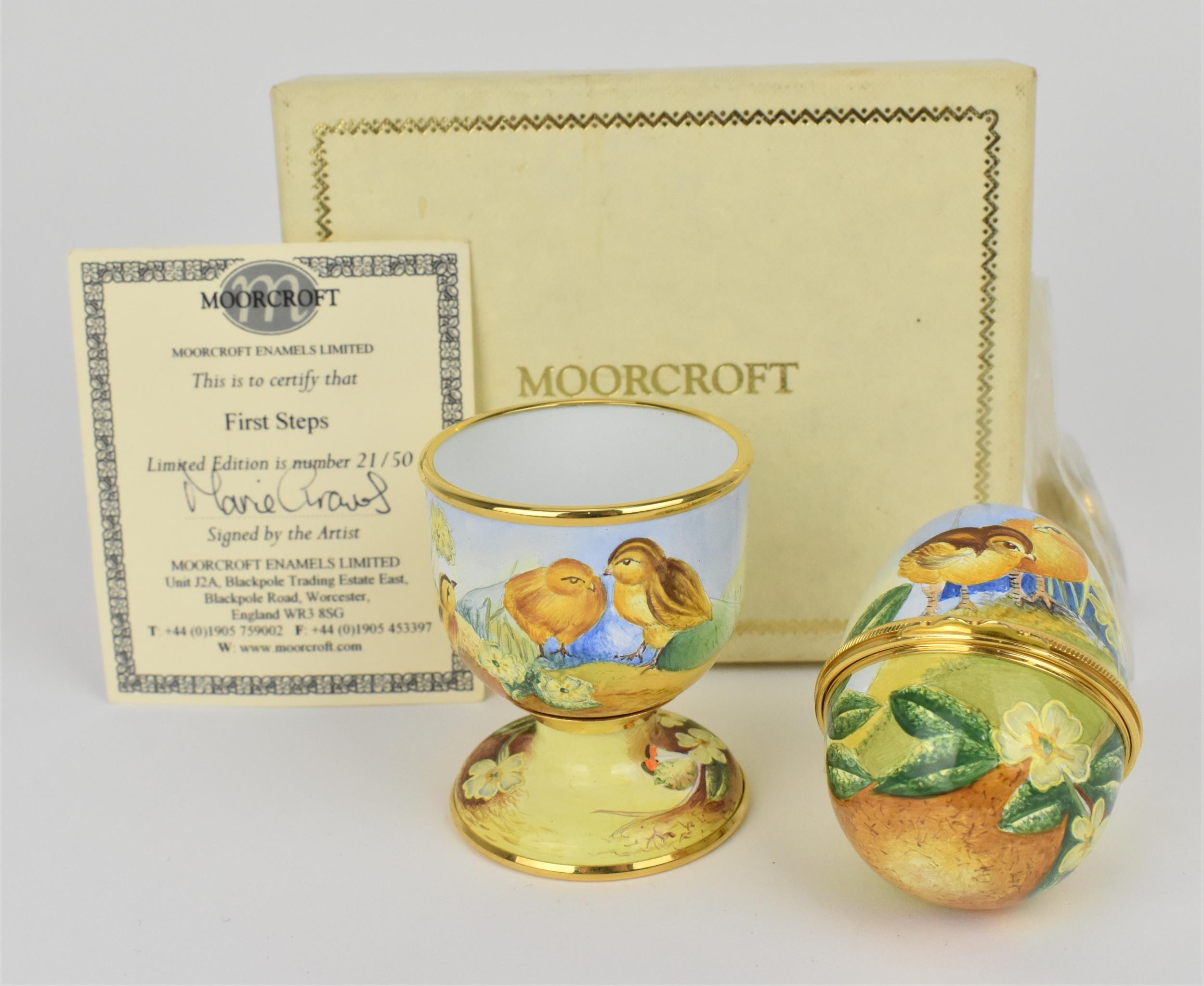A limited edition Moorcroft Enamels Ltd 'First Steps' egg cup and hinged egg painted by Marie Graves
