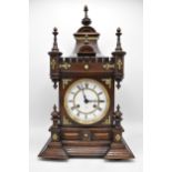 A late 19th century Junghans Black Forest mantle clock, the oak case of architectural design with