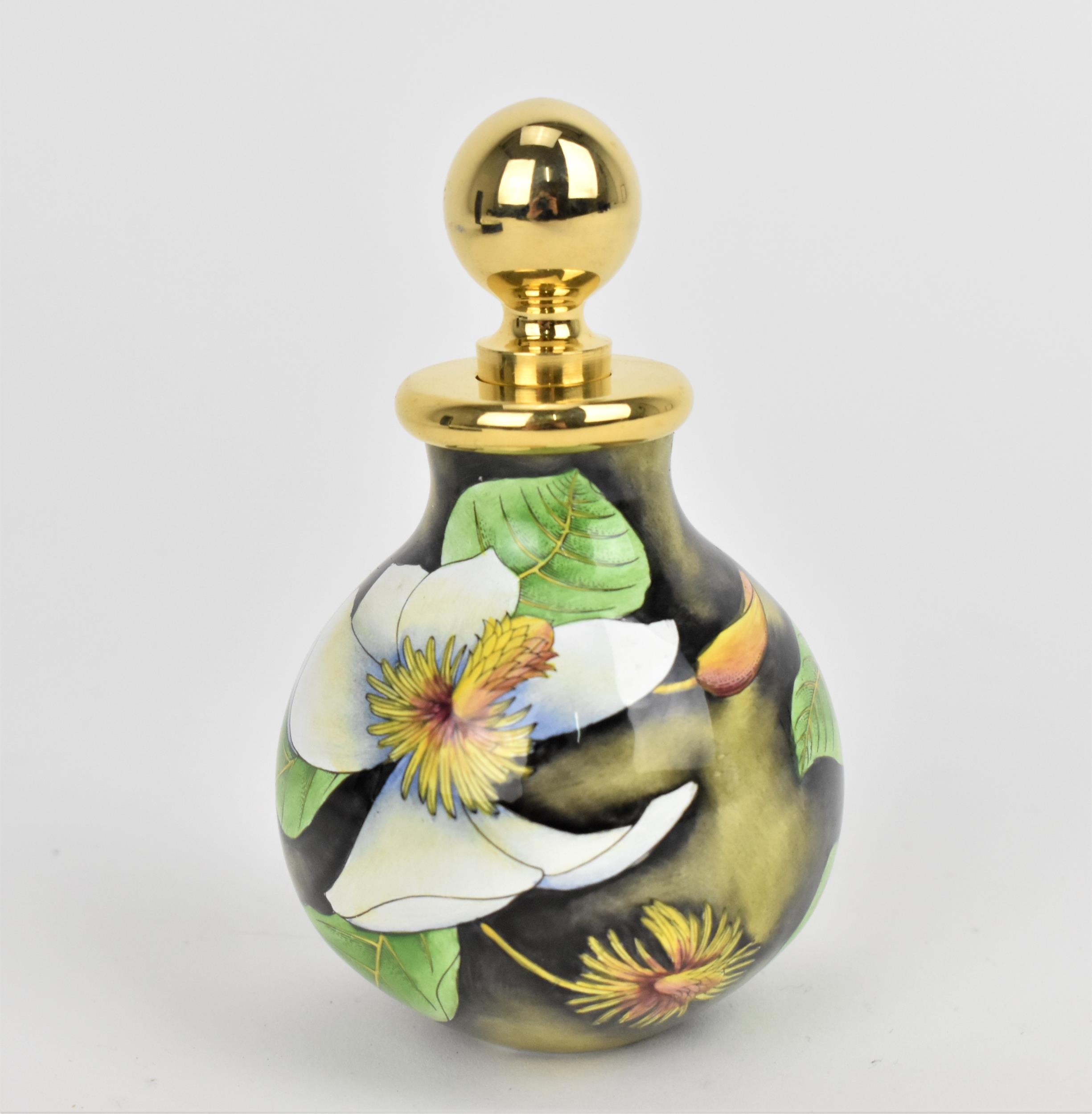 A Moorcroft Enamels Ltd perfume bottle with gilt stopper, designed by Philip Gibson and painted by