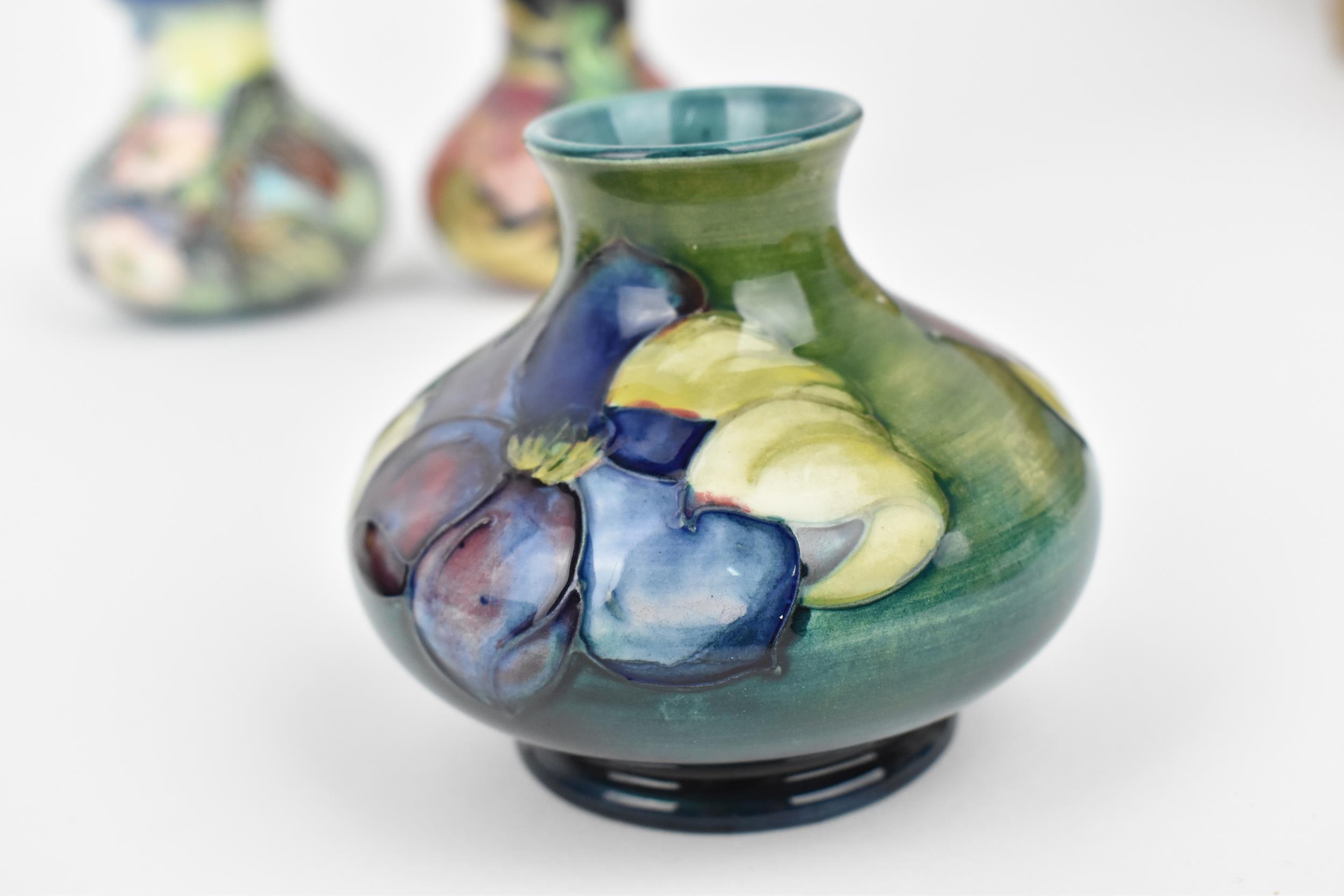 A small collection of Moorcroft ceramics, to include a squat vase in the 'Clematis' pattern on green - Image 4 of 7