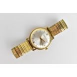 A vintage gents, tested as 9ct gold, cased manual winding wristwatch having a silvered dial with