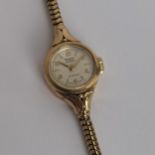 A vintage ladies 9ct gold cased manual wind Rotary wristwatch having a silvered dial, signed