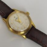 A ladies gold plated stainless steel Oris Automatic wristwatch having a silvered dial with baton and