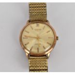 A vintage gents gold plated Automatic Longines having a gold coloured dial signed 'Longines