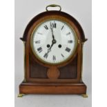 A late 19th century 8 day mantle clock, the mahogany arched top case having brass handle, columns