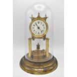 An early 20th century brass Anniversary clock with glass dome, the dial with Arabic numerals