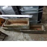 Three cast stone garden troughs with sphinx ornament, 71cm wide Location: