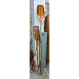 Two vintage wooden oars and a paddle Location: