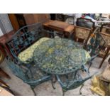 A modern green painted cast metal garden table, three chairs and a bench Location: