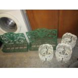 Two green painted wrought iron garden planters and three circular white painted cast aluminium