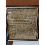 A mid 19th century sampler with numerals, the alphabet and verse by Elizabeth Weaver, framed and