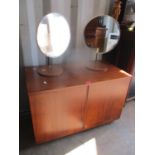 A retro teak two door record cabinet on castors, 55cm h x 83cm w, together with a pair of circular