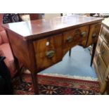 A George III mahogany straight fronted sideboard with a central drawer with later Victorian handles,