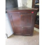 A Georgian mahogany corner cabinet having two shelves Location: