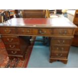 A reproduction mahogany twin pedestal desk with red leather scriber, several drawer handles A/F 76cm