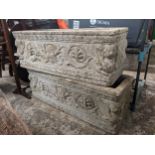 A pair of cast stone garden trough style pots with sphinx ornament, 71cm wide Location: