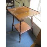 An early 20th century oak two tier square topped occasional table