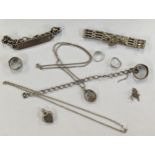 A miscellaneous lot of silver to include silver heart shaped padlock bracelet, necklaces and rings