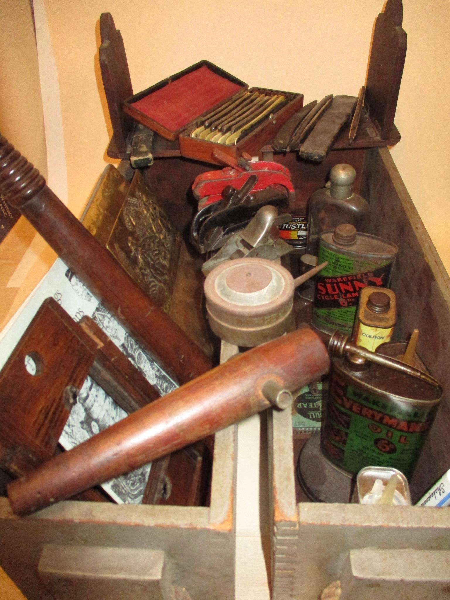 Two ammunition boxes with rope handles and contents to include mixed tins, razors and woodworking